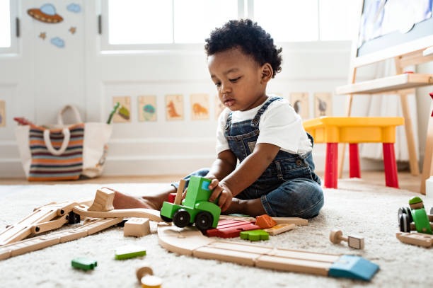 child that is playing with block toys